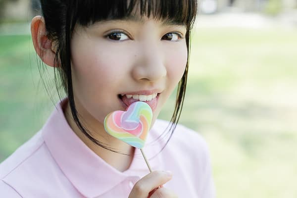 Spring scene of a nylon-clad foot arched gracefully, light catching the sheer fabric and skin